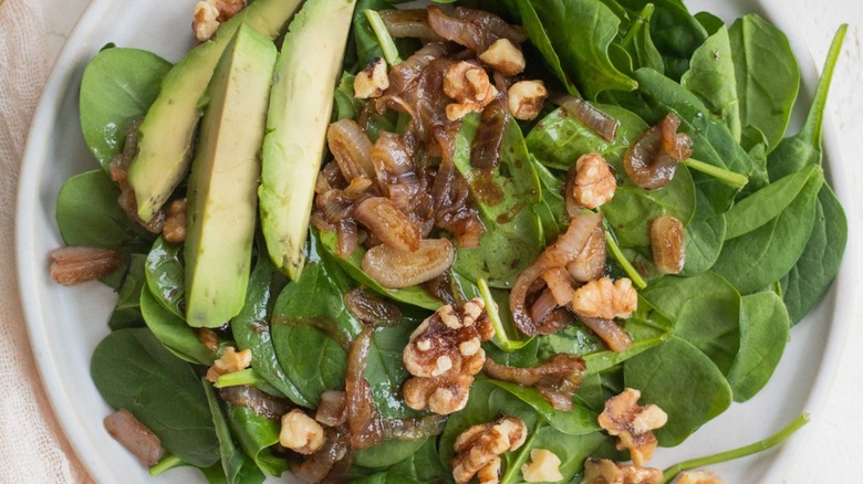 wilted spinach salad on plate