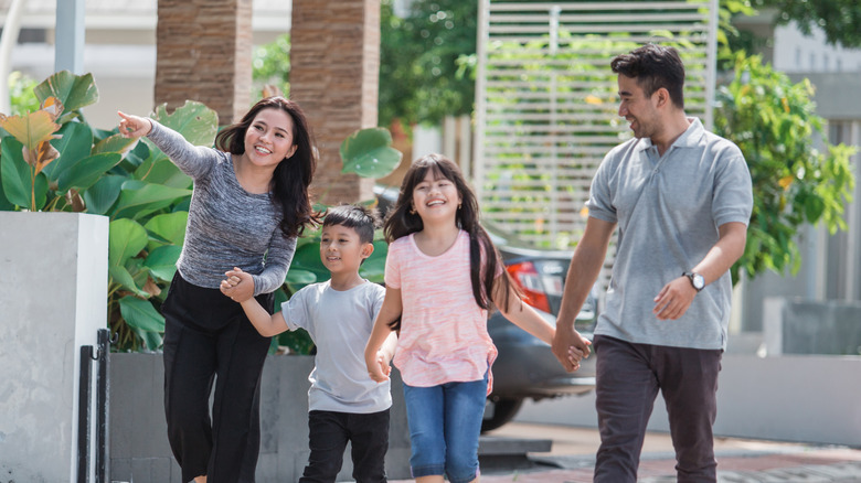 family of five walking around neighborhood