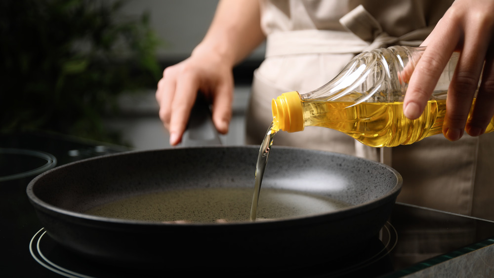 pouring oil in pan
