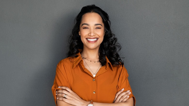 smiling woman with crossed arms