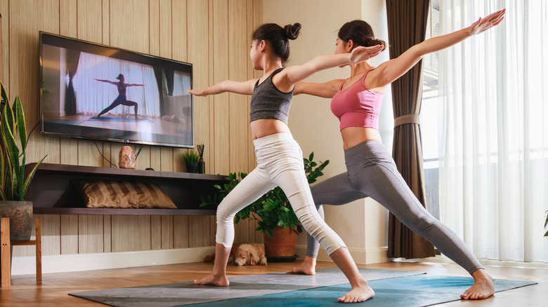 Yoga poses in front of TV 