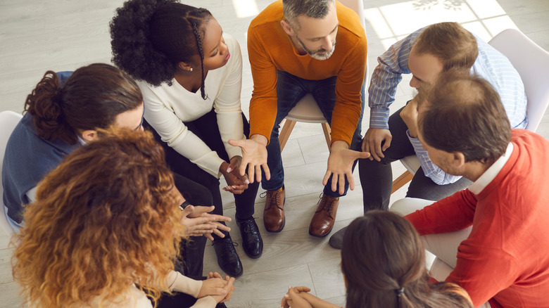 People sitting in a circle and talking