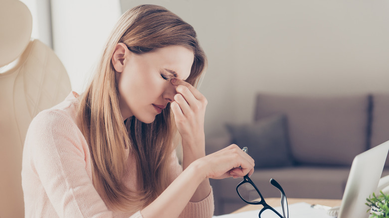 Woman with a sinus headache