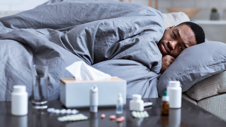 African American man in bed sick