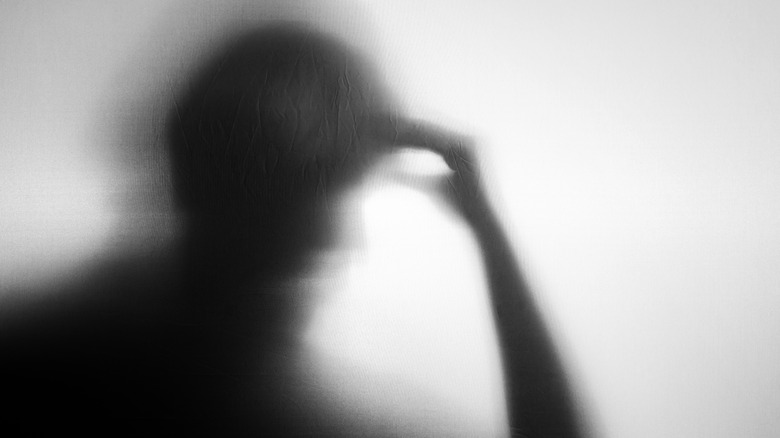 silhouette of man experiencing depression