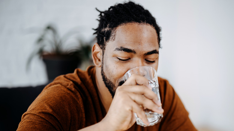 Man drinking glass of water