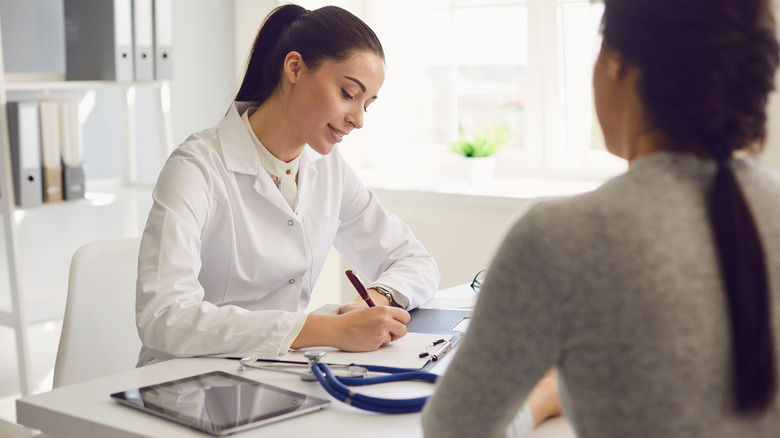 doctor talking with patient