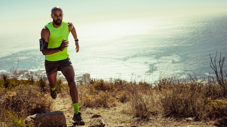 A man goes for a run in the mountains