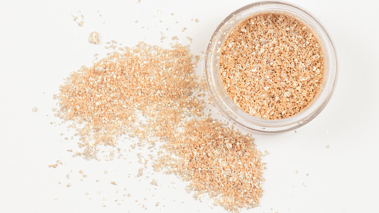 small container of luster dust