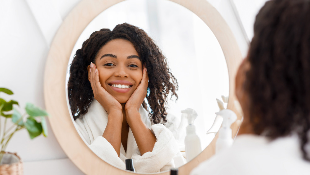 Woman looking in the mirror