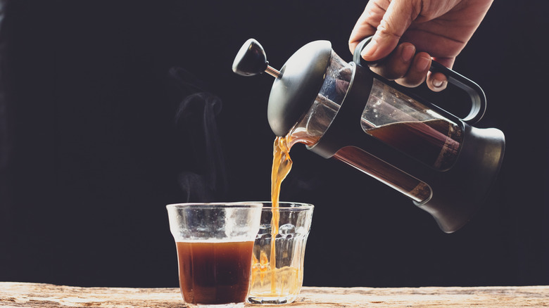 french press coffee maker and coffee in glasses