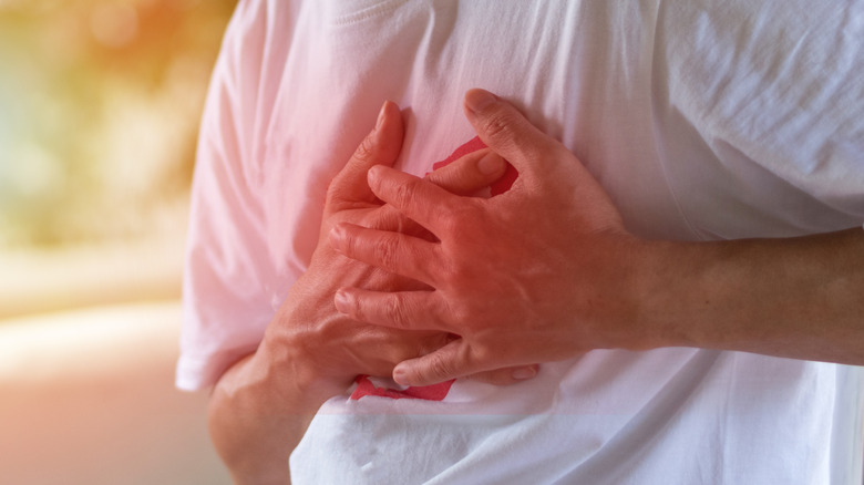 white man in park with chest pain