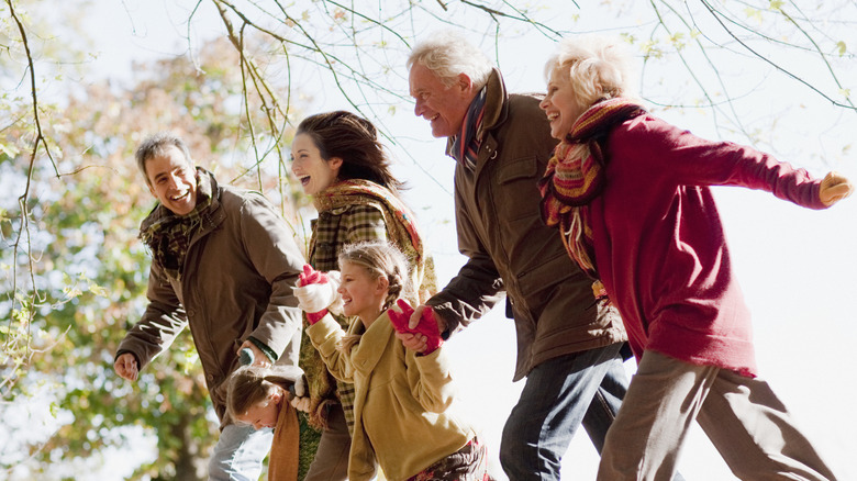 three generations of family walking outdoors