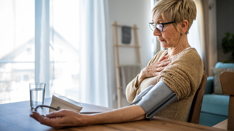 senior woman checking blood pressure
