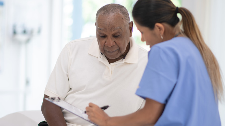 Man speaking with doctor