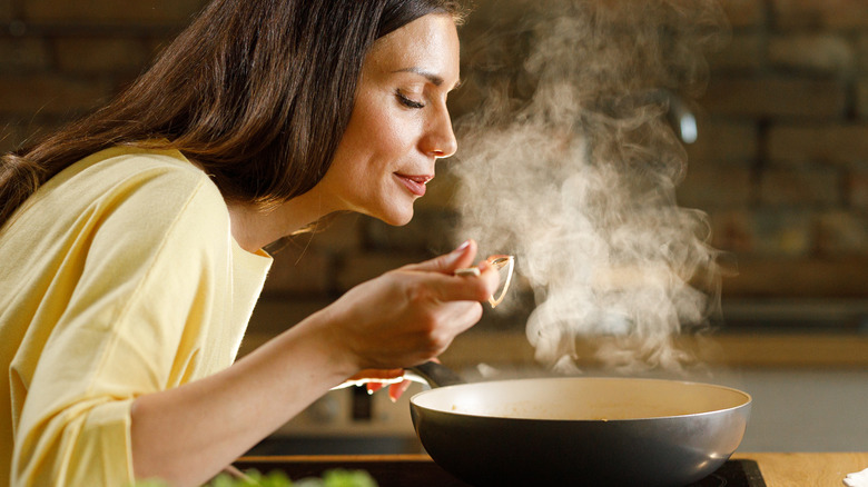 Woman about to taste food