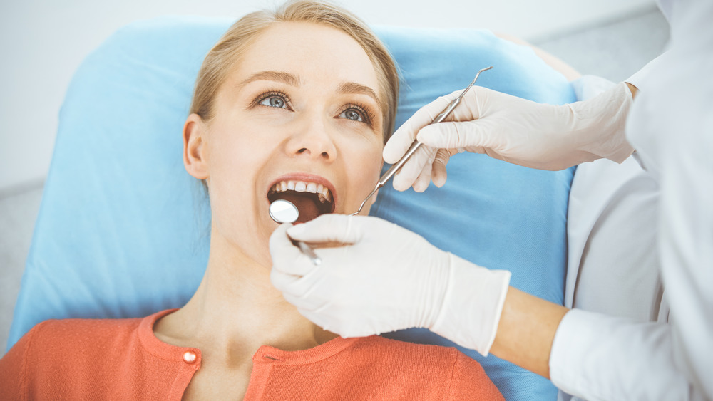 woman getting dental exam
