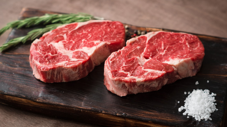 Raw red meat on a cutting board