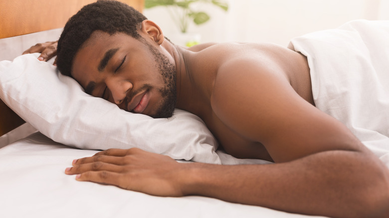 Man sleeping on stomach