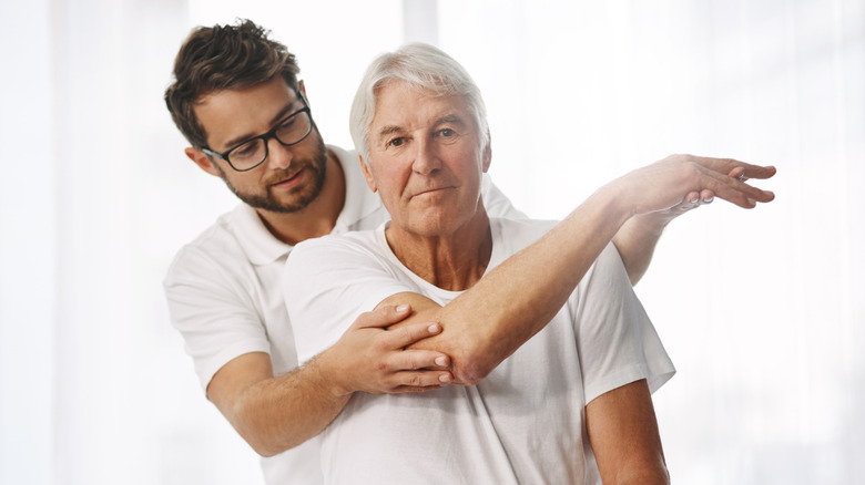 older man performing range of motion exercises