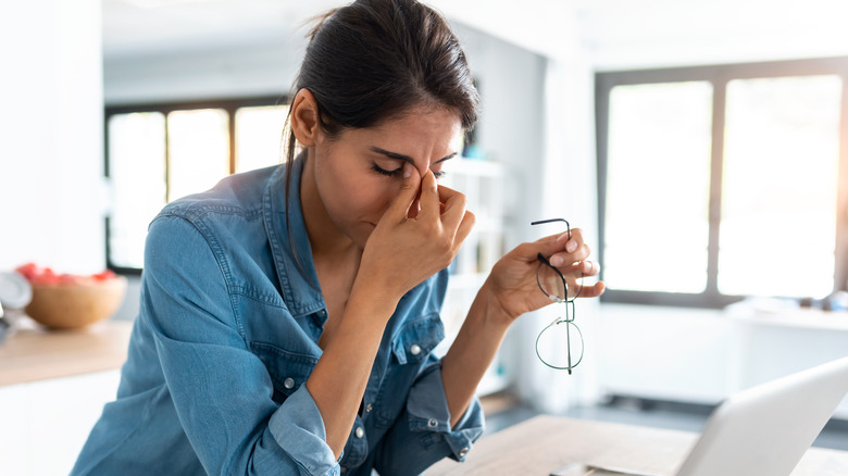 Woman feeling tired due to electrolyte imbalances