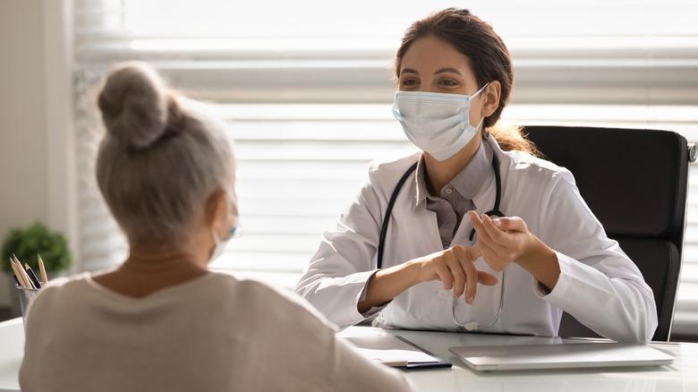 A patient and doctor talking