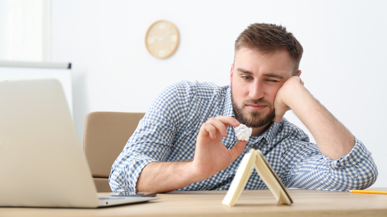Man procrastinating