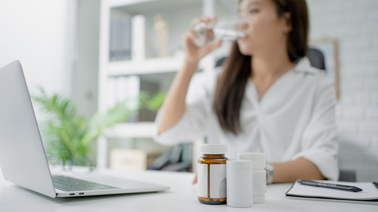 A business woman with vitamins