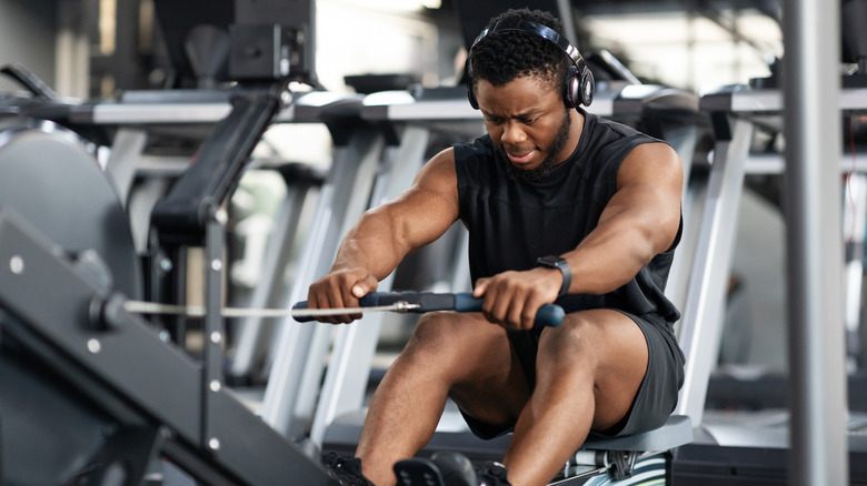 Man using rowing machine