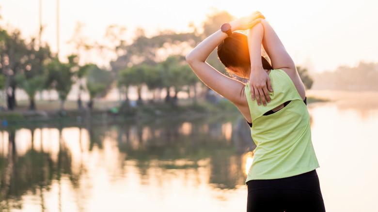 A woman stretching outdoors