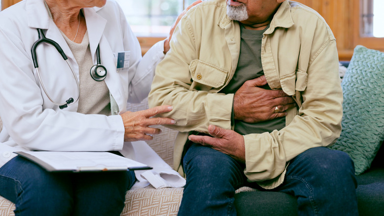 doctor having consultation with older man